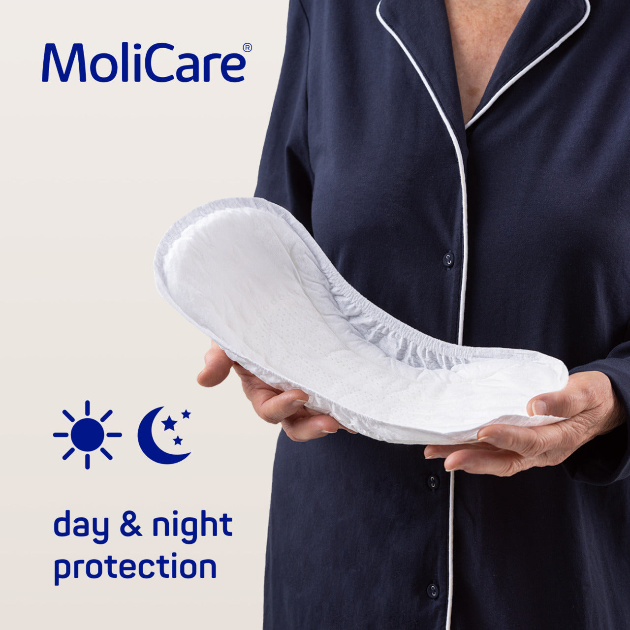Person holding a MoliCare product with 'day & night protection' text on a light background