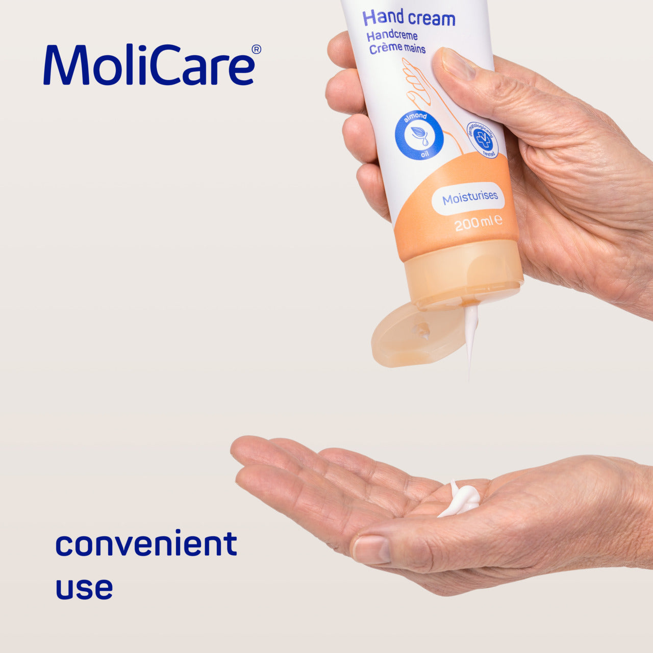 MoliCare hand cream being applied to a hand with a white background
