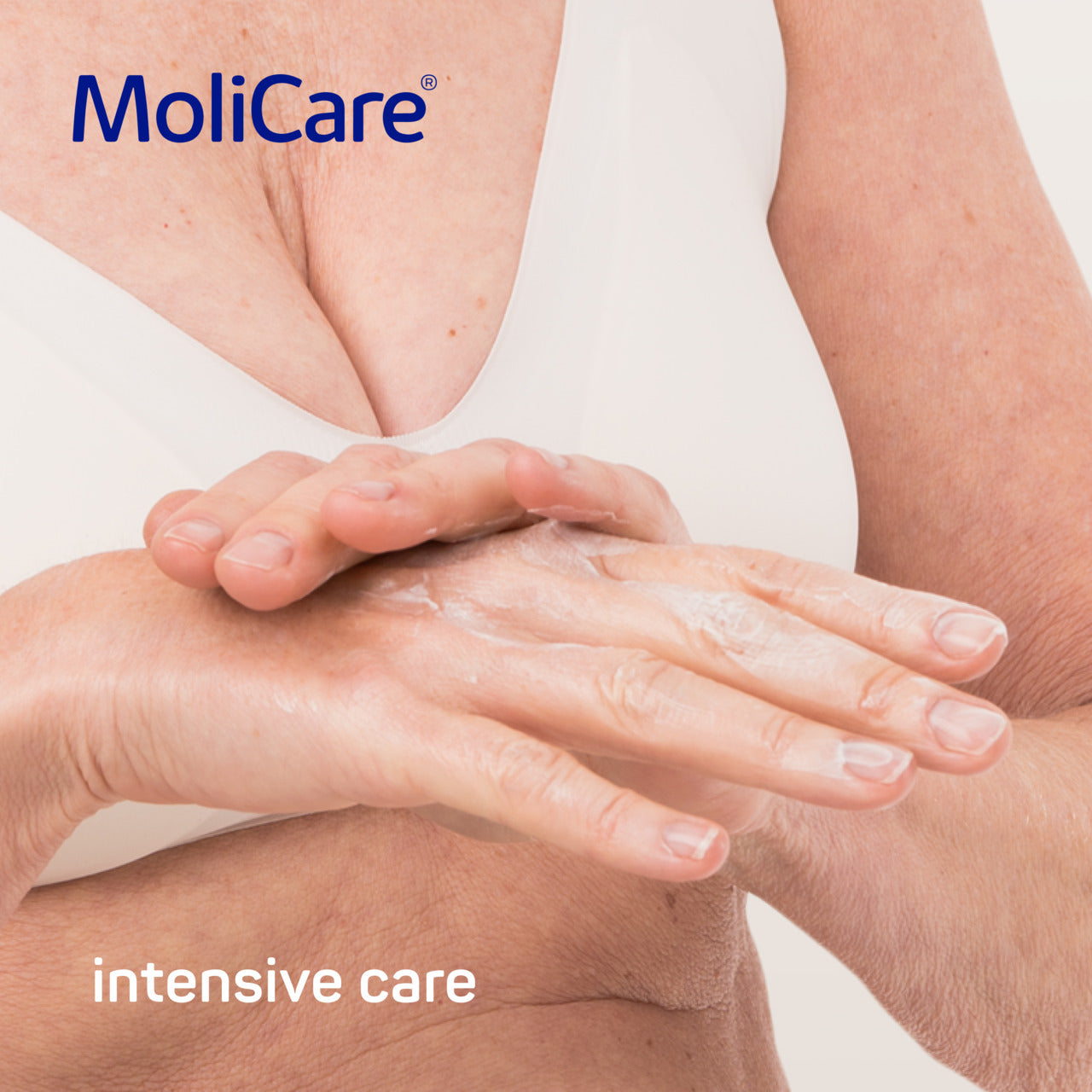 MoliCare advertisement showing hands with lotion and text 'intensive care' on a light background