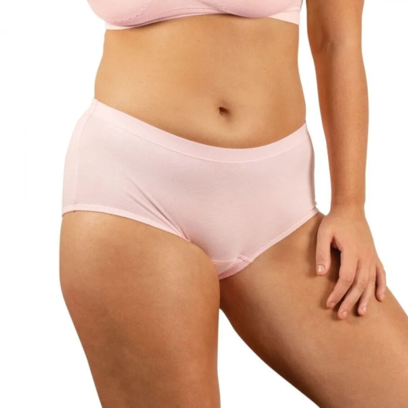 Person wearing light pink underwear on a white background