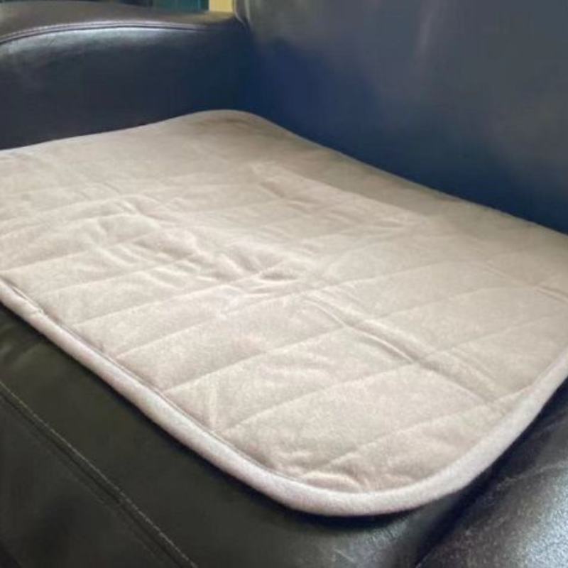 Quilted pad on a black leather surface