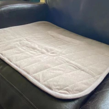 Quilted pad on a black leather surface