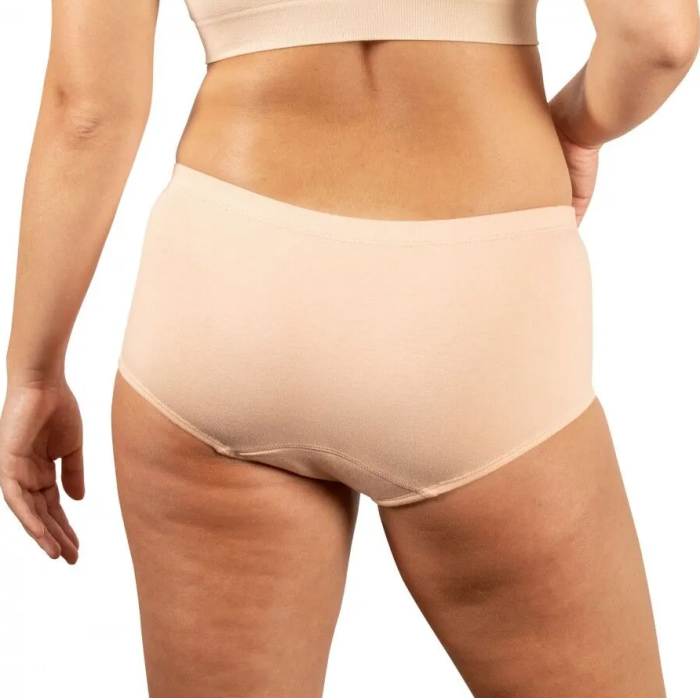 Beige high-waisted underwear worn by a person on a white background