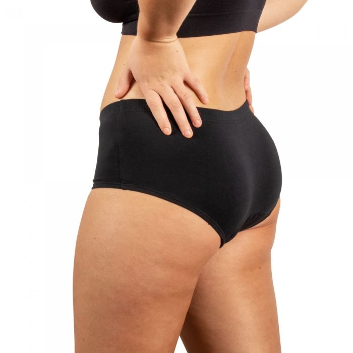 Person wearing black underwear on a white background