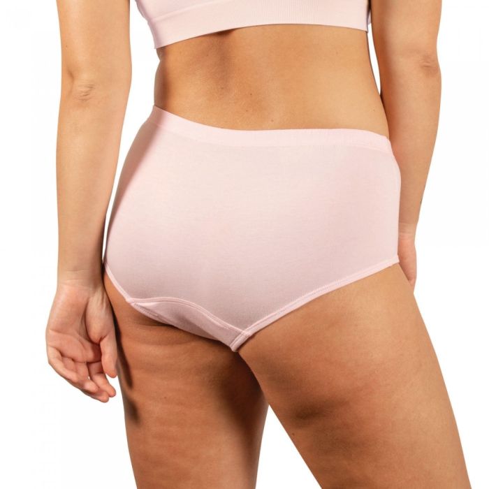 Person wearing light pink high-waisted underwear on a white background