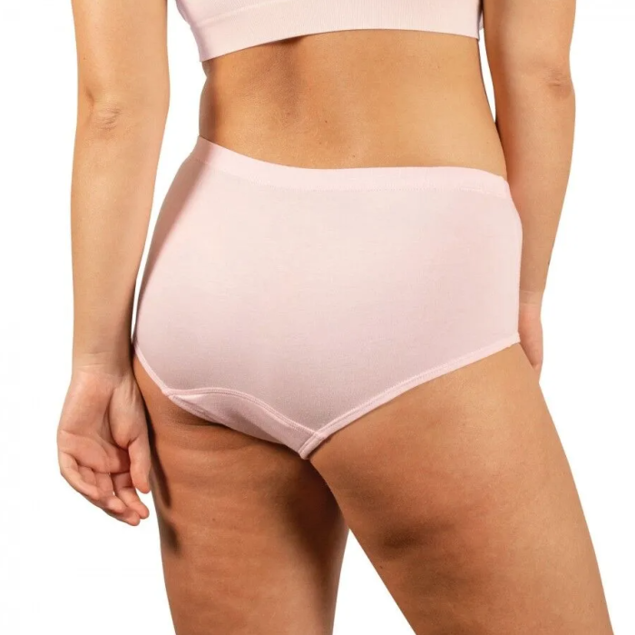 Light pink high-waisted underwear worn by a person on a white background