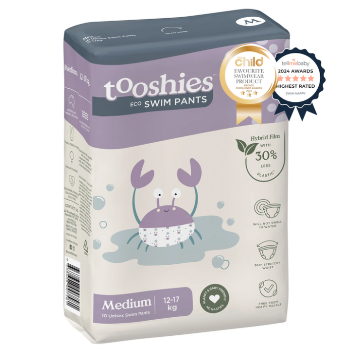 Box of tooshies eco swim pants with a purple crab illustration on a white background