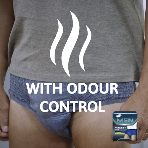 Person wearing underwear with 'Odour Control' text and a box of Men Active Fit deodorant.