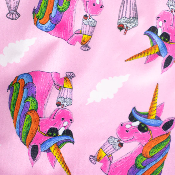Colorful unicorn illustrations on a pink background